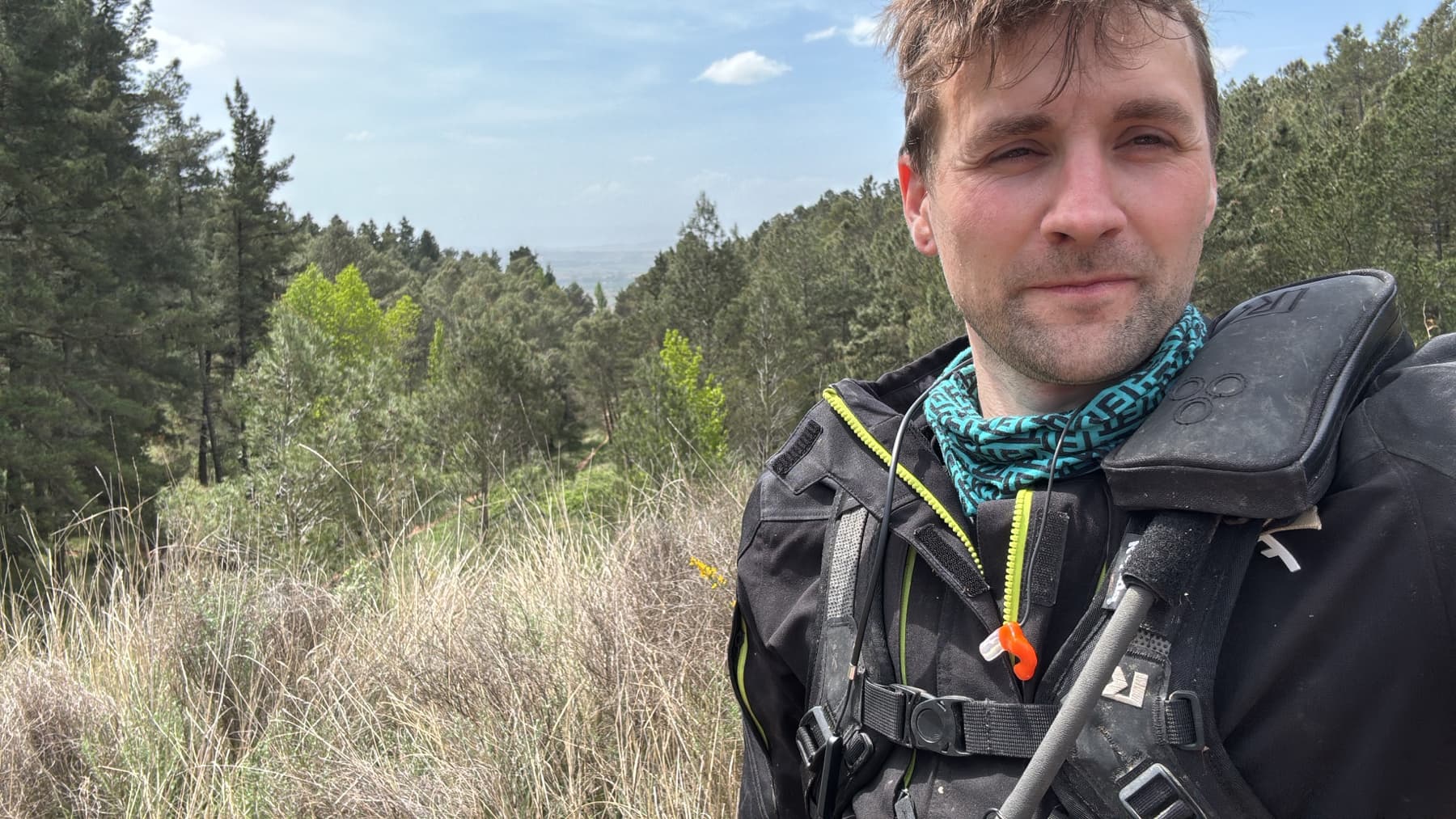 Matt, founder of Roadbook Ready, wearing rally riding gear on a trail